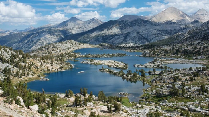 An aerial view of Marie Lake beneath a cloud-spotted sky