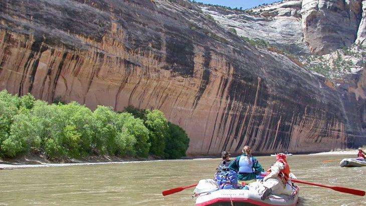 rafts approach Tiger Wall on the Yampa River