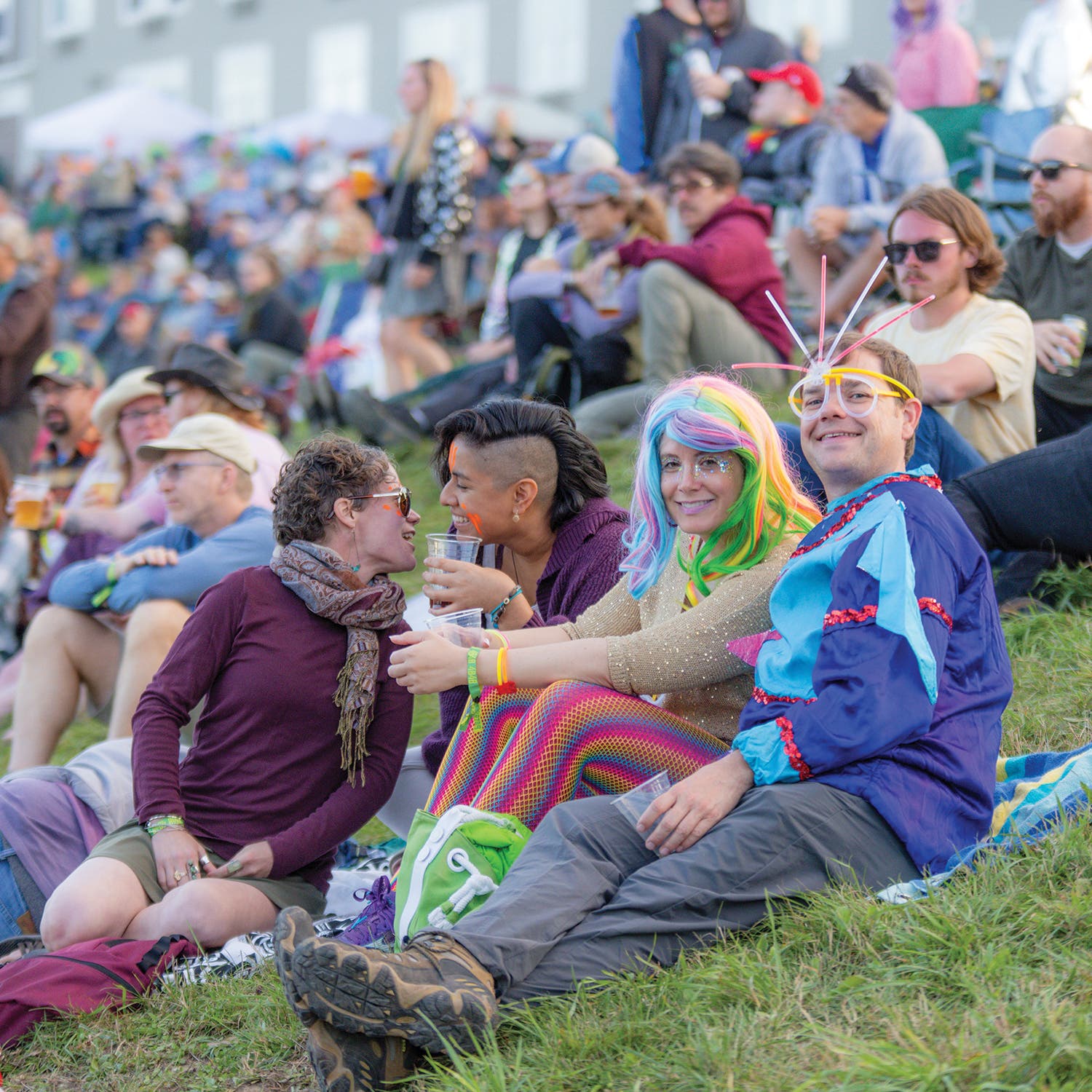 Concert-goers enjoying an evening set at one of two main stages