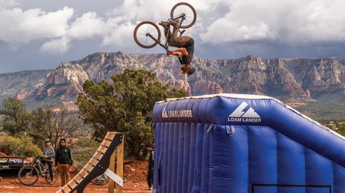 A rider tests his aerial skills on the airbag jump.