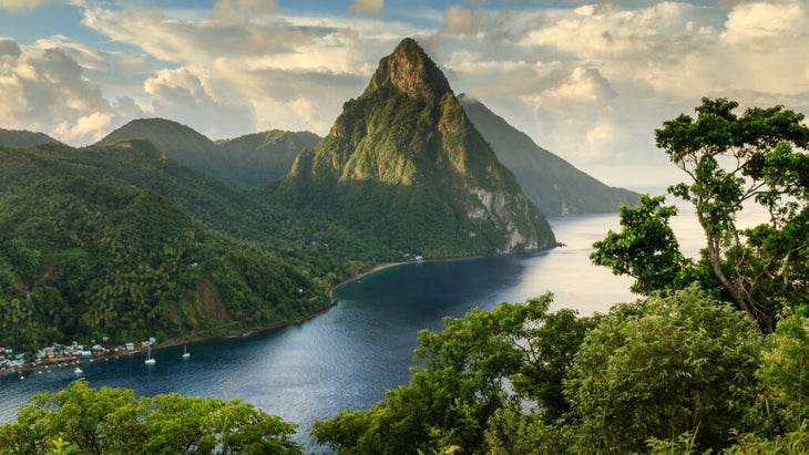 A romantic view of Saint Lucia's Pitons and Soufrière Bay shows why it's a top spot with honeymooners.