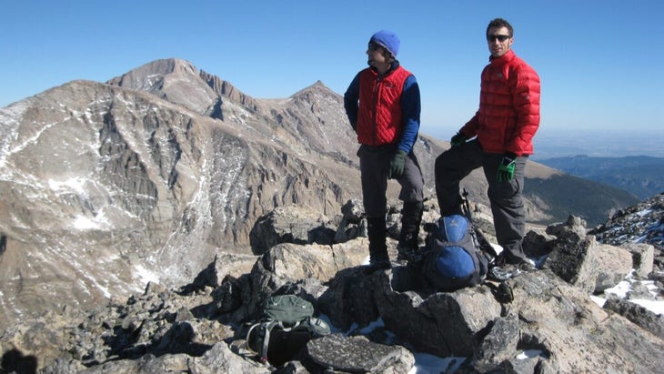 Two men atop Mount Alice in Rocky Mountain National Park admire their surrounds above the tree line.