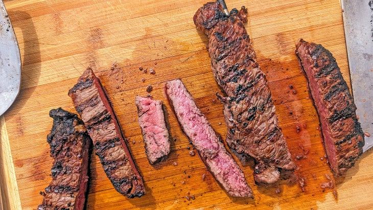 charcoal grilled steak on a cutting board 