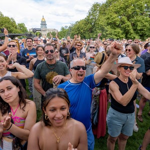 Crowds cheer at the Outside Festival.
