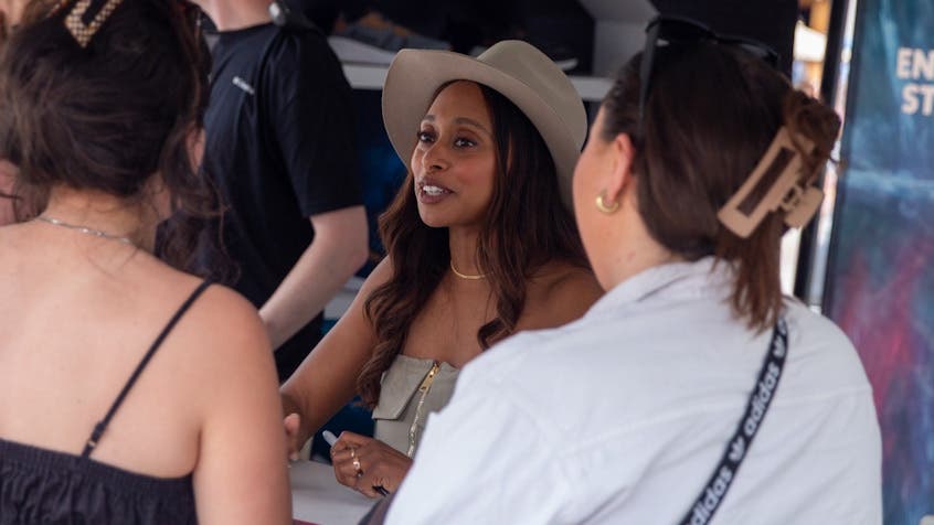Fans meet with Dr. Rae Wynn-Grant at the Outside Festival.