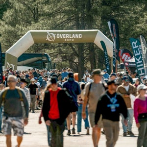 crowds entering Overland Expo under inflatable arch