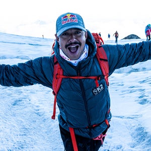 Nims Purja stands on a mountain.