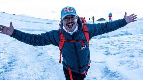 Nims Purja stands on a mountain.