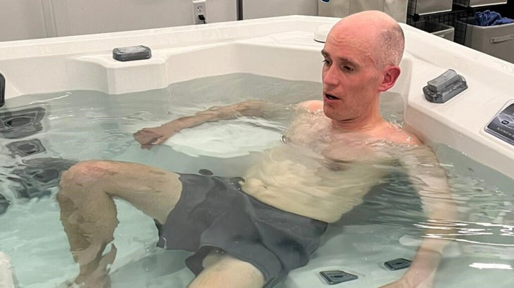 Writer Alex Hutchinson jumps in the hot tub after his hot run on the treadmill