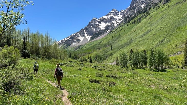 two hikers go up East Maroon, above Aspen, Colorado