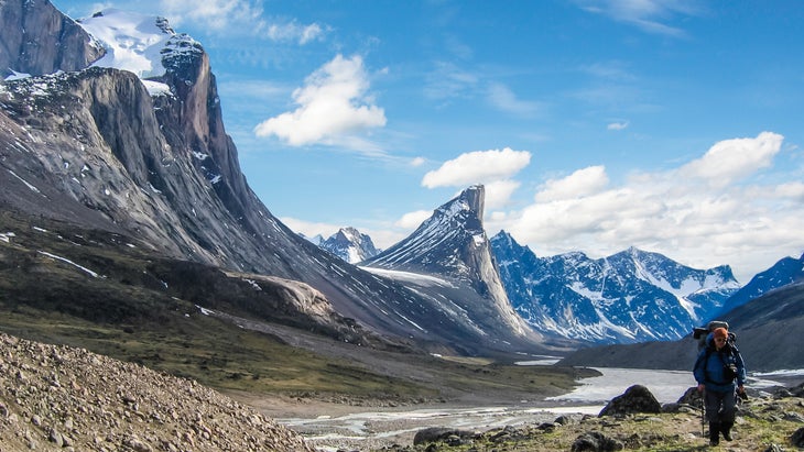 man hikes on Akshayuk Trail, Auyuittuq National Park