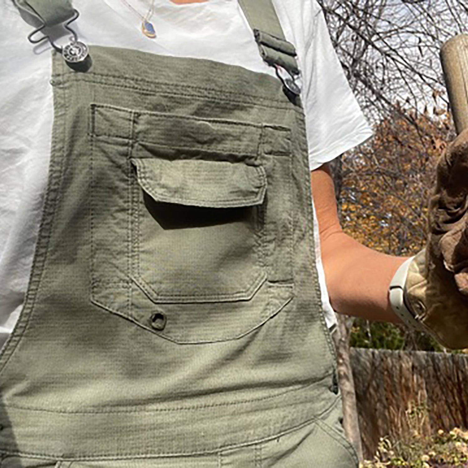 Dovetail overalls on woman with gloves and shovel