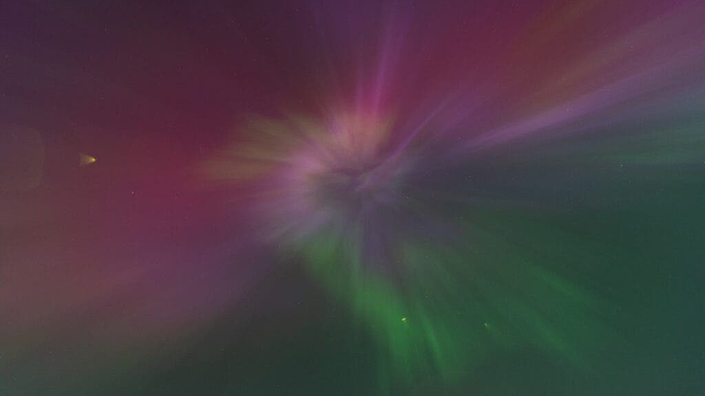 A spiral aurora taken by the author over Cleveland on May 10 features pink and green prominently.