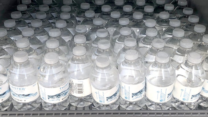 Rows of plastic water bottles, which eventually become microplastics that find their way into human bodies--heart, lungs, blood and testicles