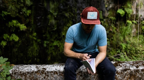 Rush Sturges outside with a notebook