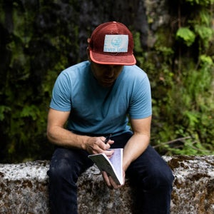 Rush Sturges outside with a notebook