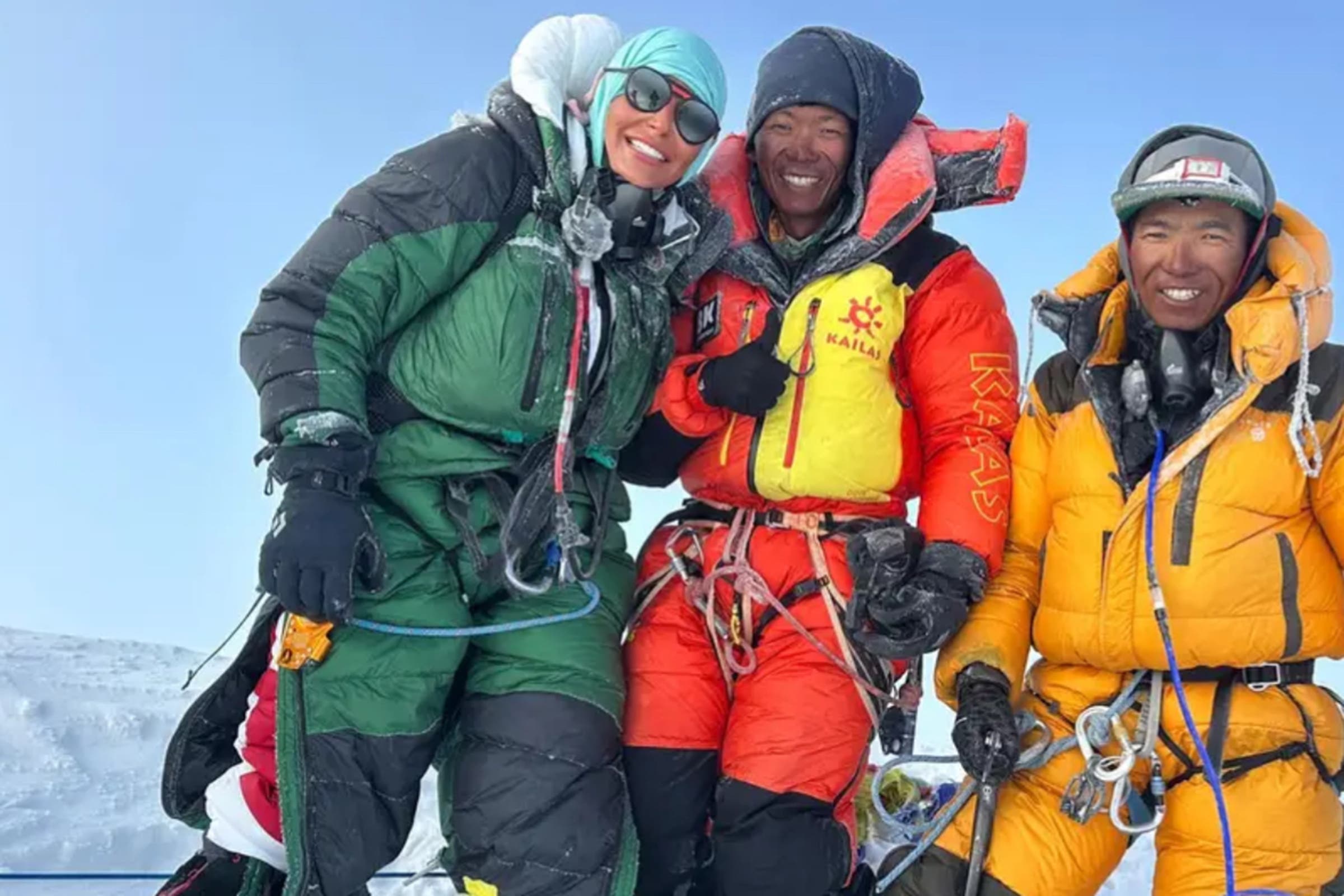 Three climbers on top a mountain