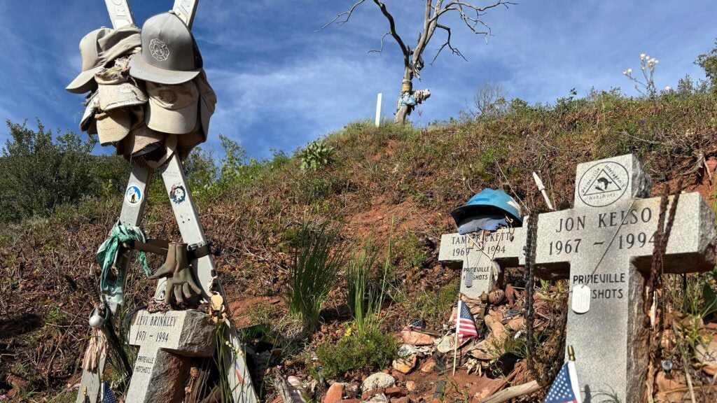 memorial crosses and skis show on the slopes of Storm King Mountain