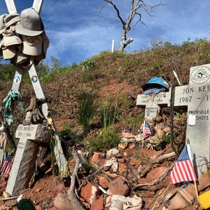 memorial crosses and skis show on the slopes of Storm King Mountain