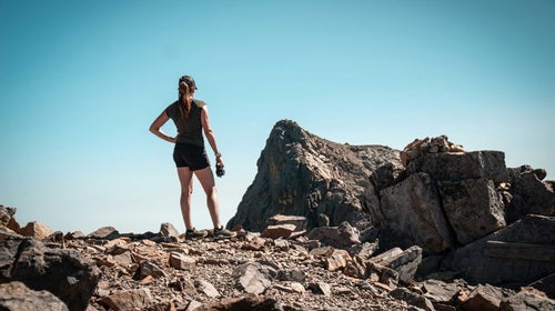 women's workout apparel shorts and t-shirt on a hike