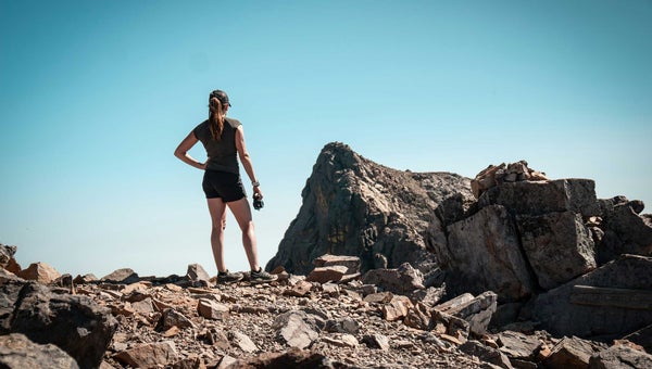 women's workout apparel shorts and t-shirt on a hike