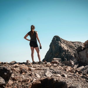 women's workout apparel shorts and t-shirt on a hike