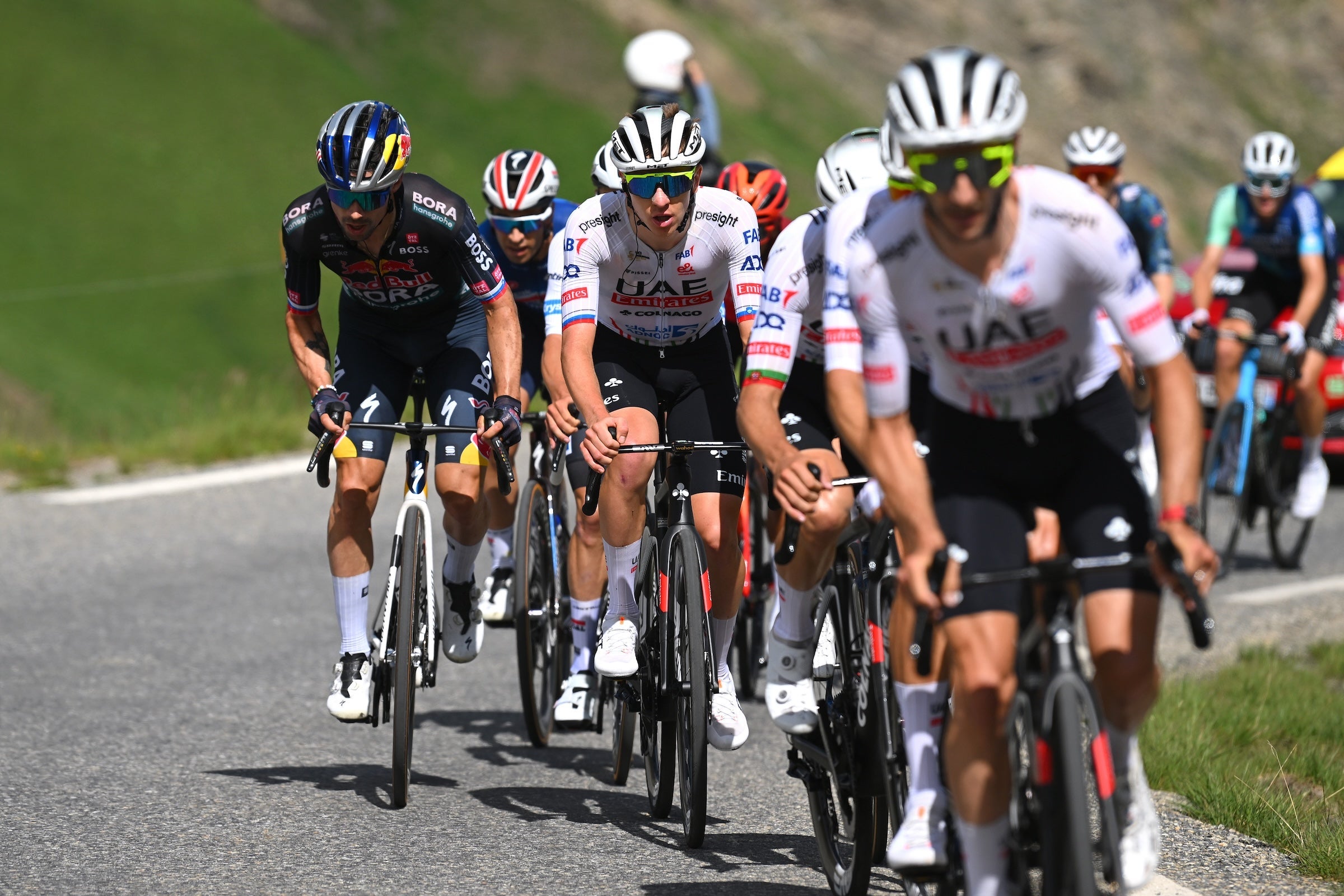 VALLOIRE, FRANCE - JULY 02: (L-R) Primoz Roglic of Slovenia and Team Red Bull – BORA – hansgrohe and Tadej Pogacar of Slovenia and UAE Team Emirates compete in the breakaway during the 111th Tour de France 2024, Stage 4 a 139.4km stage from Pinerolo to Valloire / #UCIWT / on July 02, 2024 in Valloire, France. (Photo by Dario Belingheri/Getty Images)