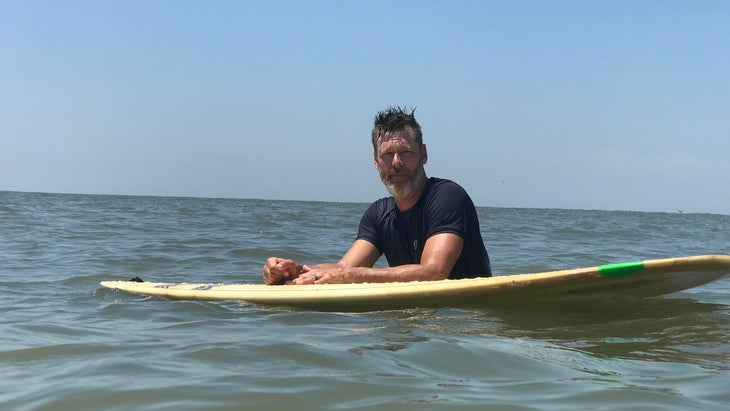 Graham Averill with surfboard