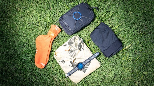 5 pieces of running gear on a grass background