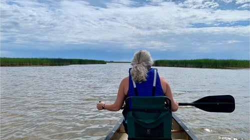 Senior running gear editor Jonathan Beverly and his wife paddle on Lake Ogallala in western Nebraska.