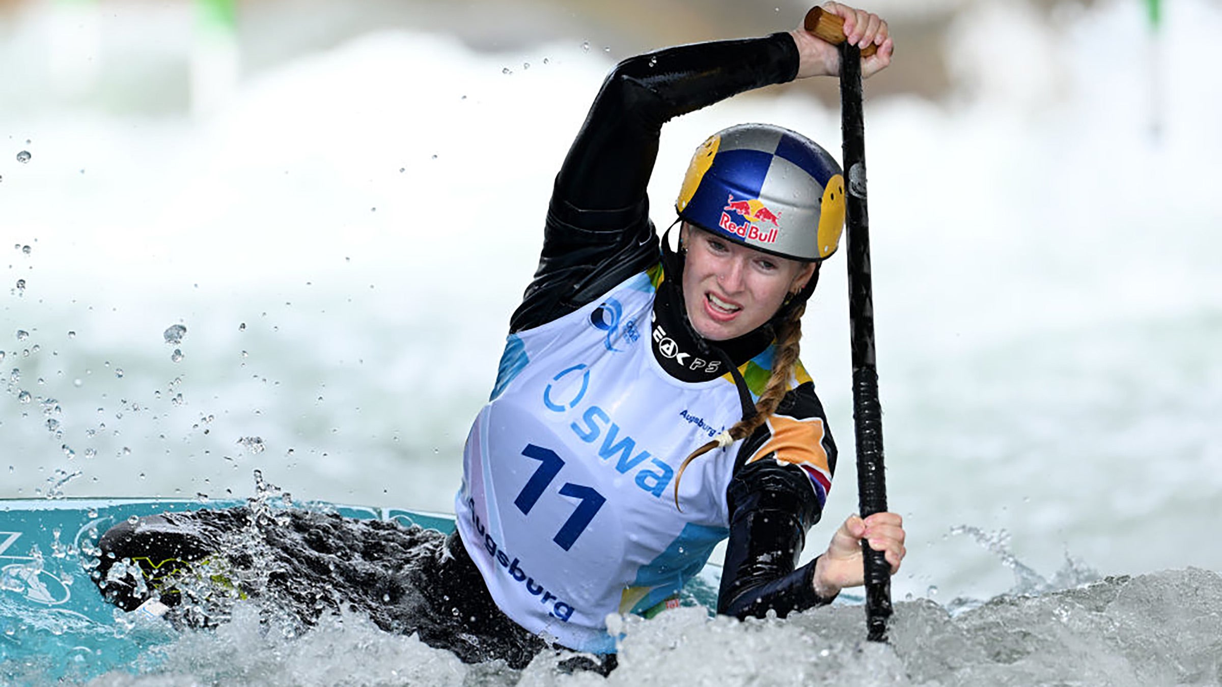 A kayaker navigates rough whitewater