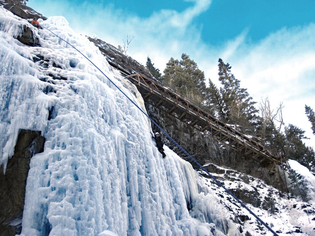 Ice climbing under a bridge