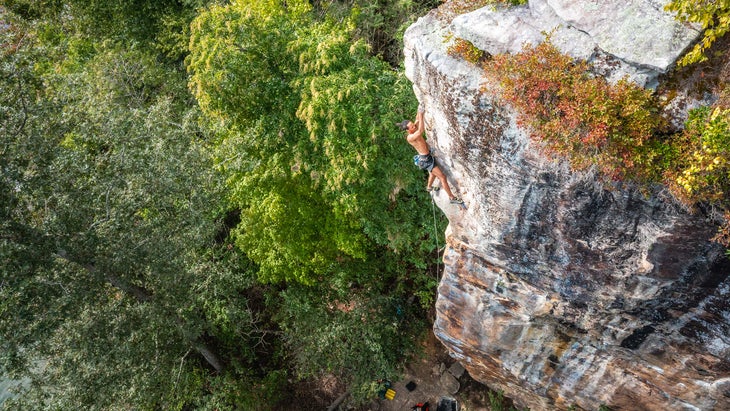 man rock climbing at Summersville Lake
