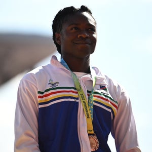 Bronze medallist Namibia's Christine Mboma poses during the medal ceremony for the women's 200m athletics event at the Alexander Stadium, in Birmingham on day ten of the Commonwealth Games in Birmingham, central England, on August 7, 2022.