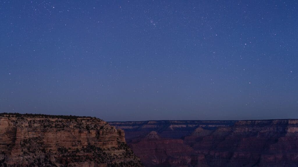 A clear, star-filled night sky above the Grand Canyon’s South Rim