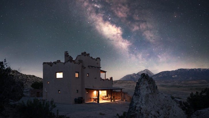 A glowing Milky Way shines above the Star Tower lodging at Colorado’s Canyon of the Ancient.