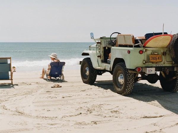 Jeep with surfboard on the beach at Ocracoke Island