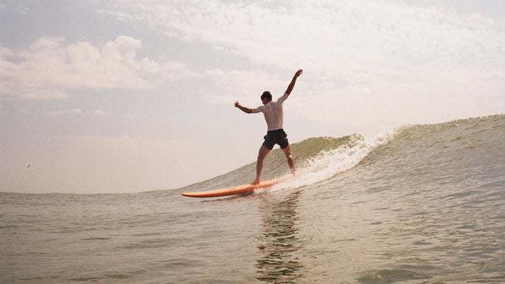 surfer rides waves at Ocracoke Island