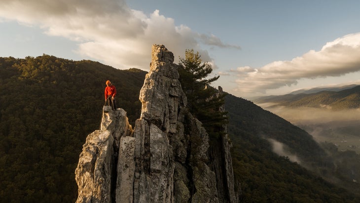 climber on top of Seneca Rocks