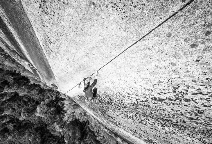 Climber ascends steep finger crack in Chile.