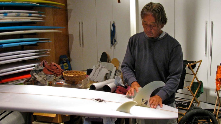 Surfboard shaper Guy Okazaki at work