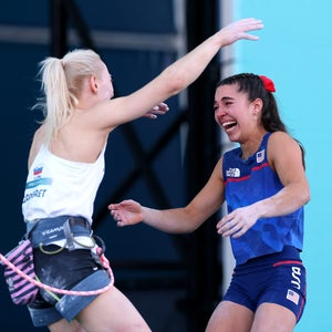 Brooke Raboutou (in tears) giving Janja Garnbret (still roped up) a hug after learning that they'll stand together on the Olympic podium