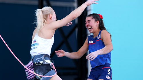 Brooke Raboutou (in tears) giving Janja Garnbret (still roped up) a hug after learning that they'll stand together on the Olympic podium