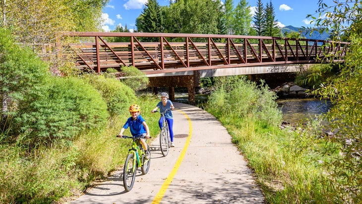 child and woman ride at Rio Grande Trail, Aspen