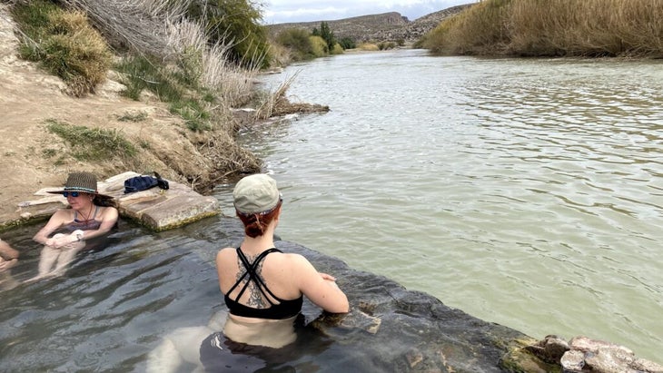 The author lazes in Boquillas Hot Springs, looking upstream at the Rio Grande.