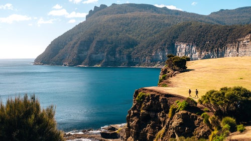 Hikers trek Tasmania’s Bishop and Clerk Track, which overlooks Fossil Bay.