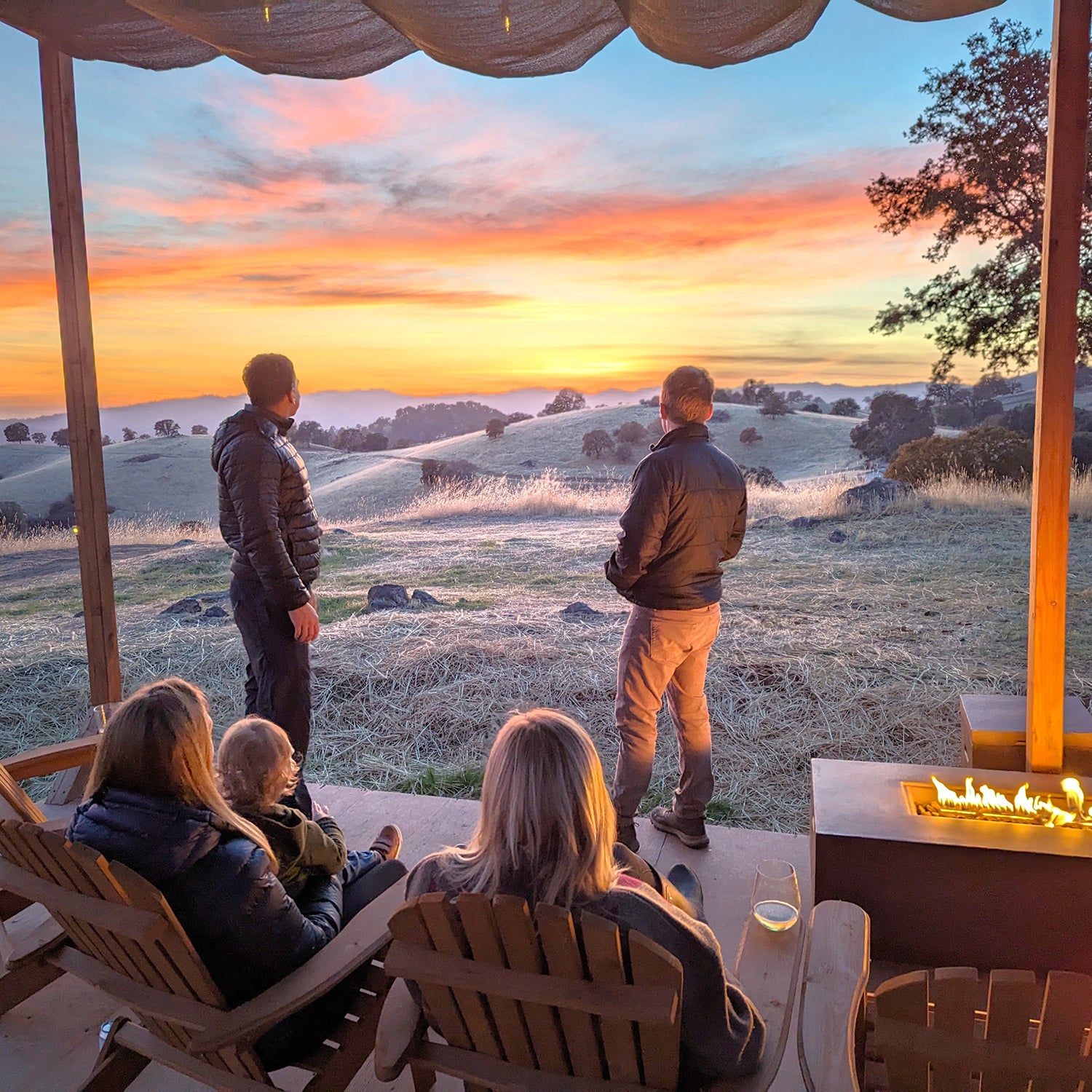 people look out at sunset from glamping lodge near Yosemite