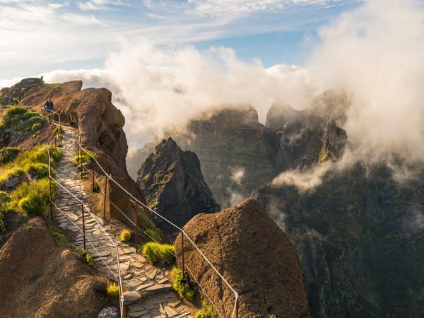 Hikers walking on Pico do Arieiro trail, Madeira, Portugal
