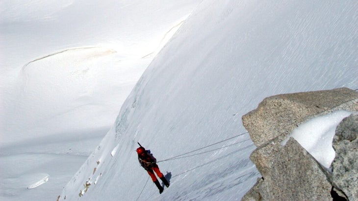 Tim Neville rappels himself down a sheer icy face of . It was preferable to the alternative.