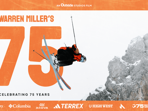 Orange border with skier mid air. Big 75 in orange font.